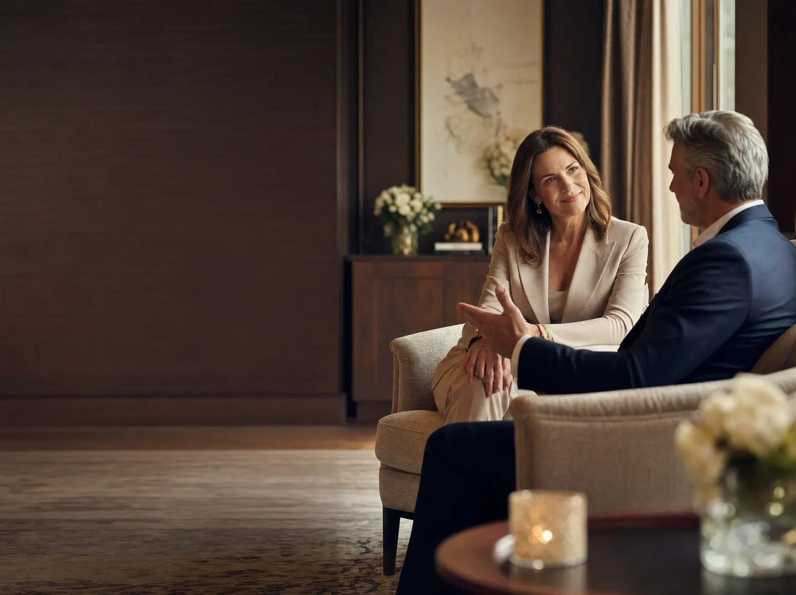 A matchmaker speaking with a prospective client during a private consultation