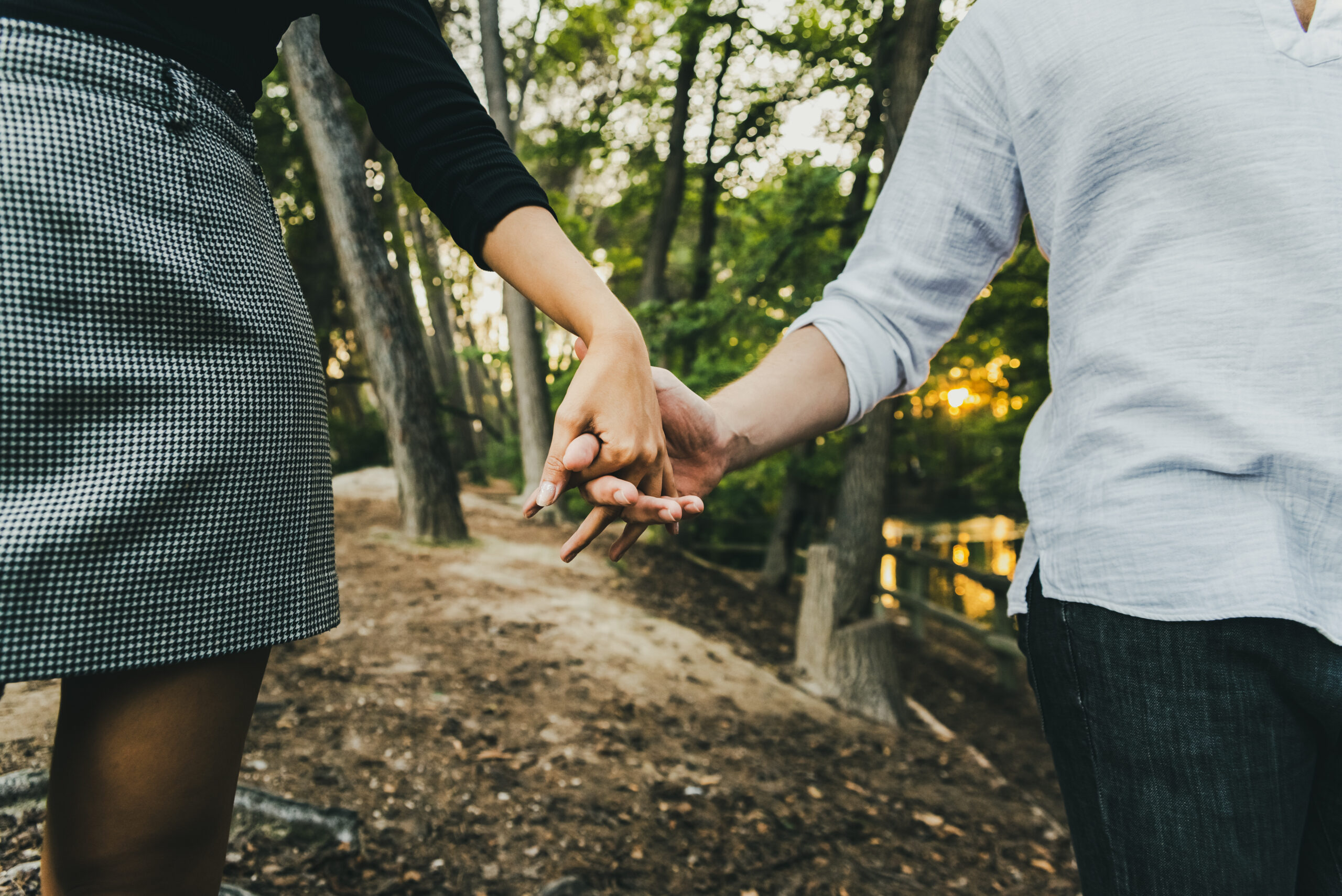 Lviv Women matchmaking process image showing a couple's hands intertwined to symbolize trust, commitment, and relationship direction